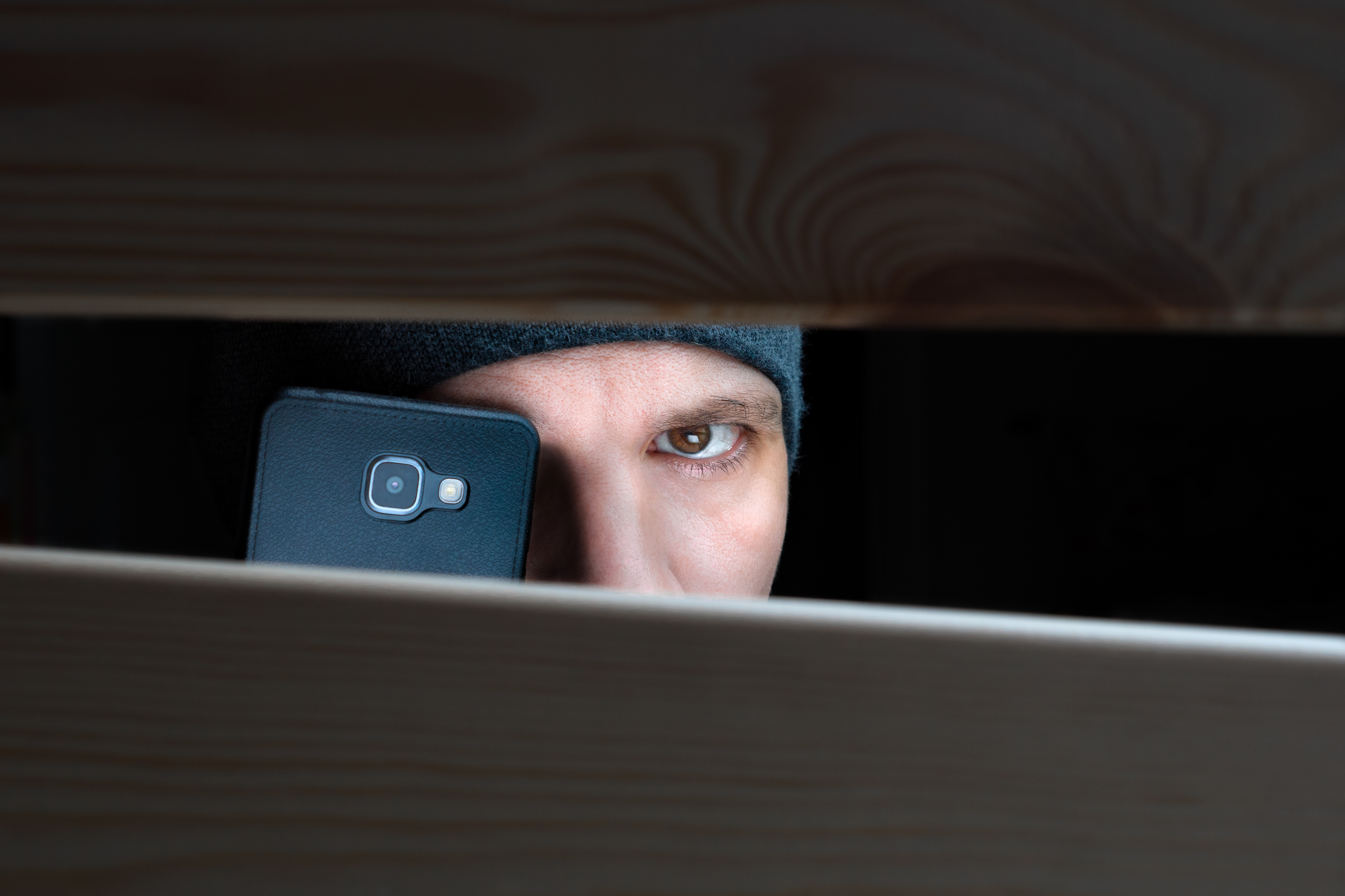 Man secretly filming person without consent in private act