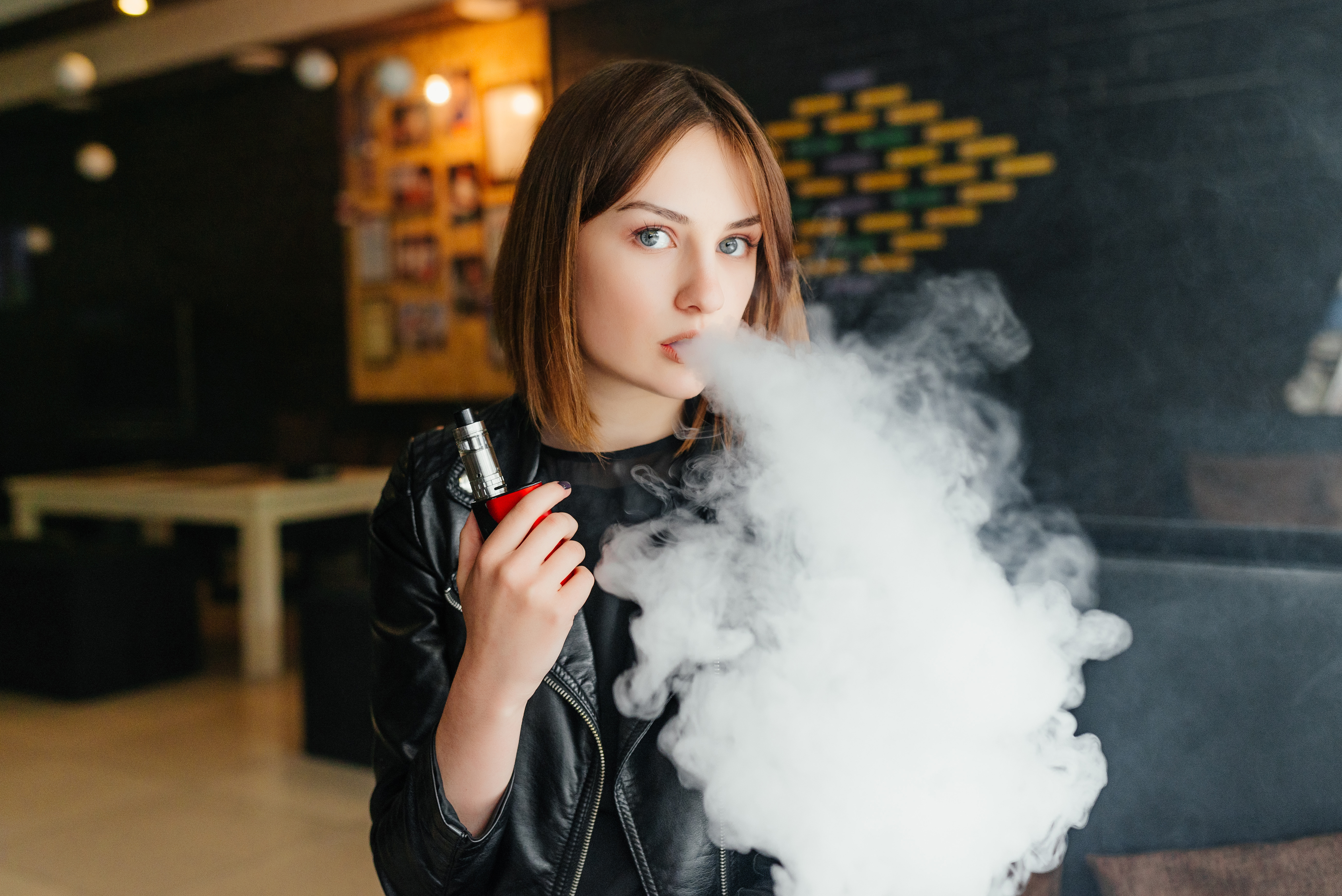 Girl possessing and smoking liquid nicotine