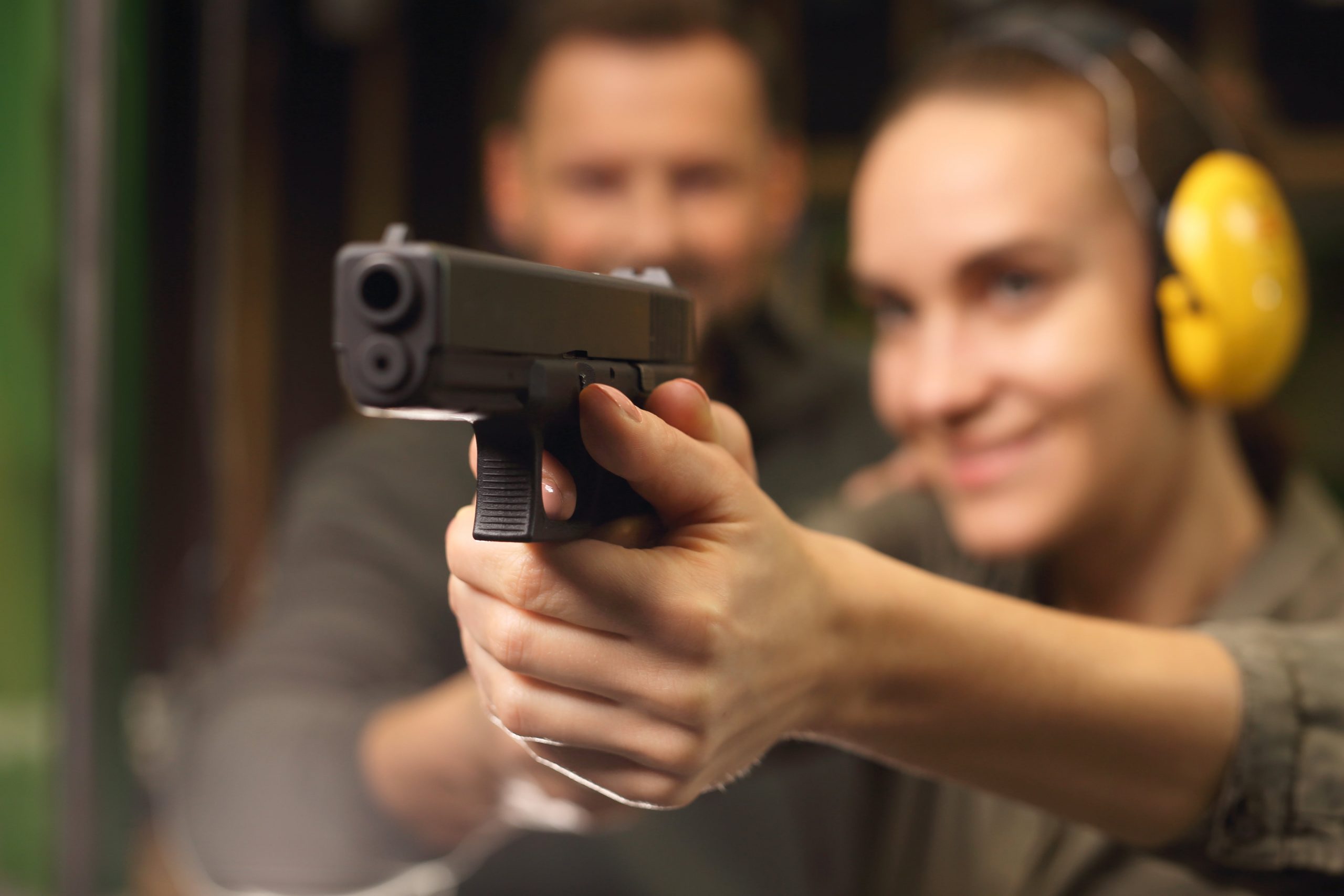 firearm held by woman